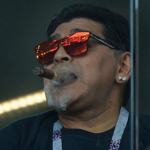 Argentina's football legend Diego Maradona smokes a cigare as he attends the Russia 2018 World Cup Group D football match between Argentina and Iceland at the Spartak Stadium in Moscow on June 16, 2018. (Photo by Juan Mabromata / AFP) / RESTRICTED TO EDITORIAL USE - NO MOBILE PUSH ALERTS/DOWNLOADS        (Photo credit should read JUAN MABROMATA/AFP/Getty Images)